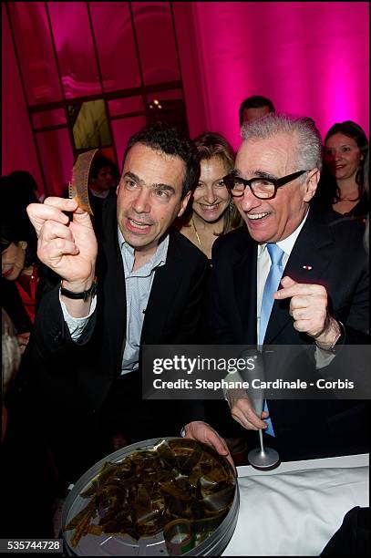 Martin Scorsese looking at films of Georges Melies during the party of "Hugo Cabret 3D", at Petit Palais in Paris.