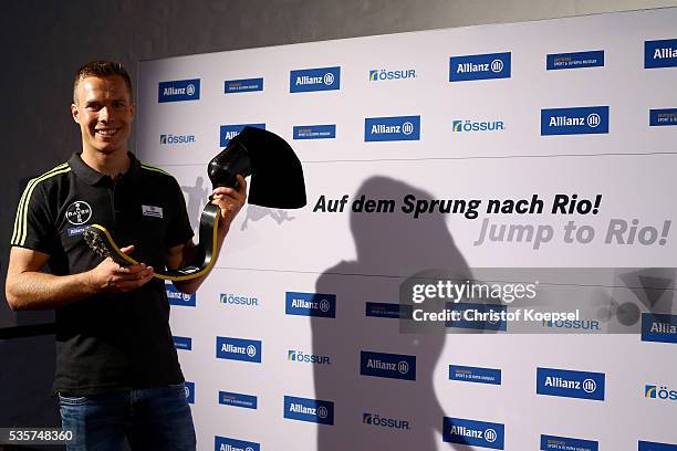 Markus Rehm, handicapped longjumper and Paralympics winner of London 2012 poses qith his prothesis after a press conference at German Sport & Olympic...