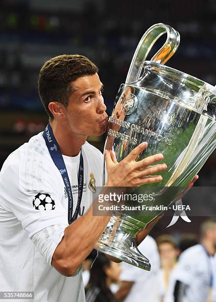 Cristiano Ronaldo of Madrid holds the winners trophy after the UEFA Champions League Final match between Real Madrid and Club Atletico de Madrid at...