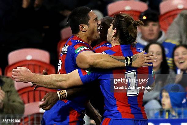 Sione Mata'utia of the Knights celebrates his try with Jake Mamo during the round 12 NRL match between the Newcastle Knights and the Parramatta Eels...