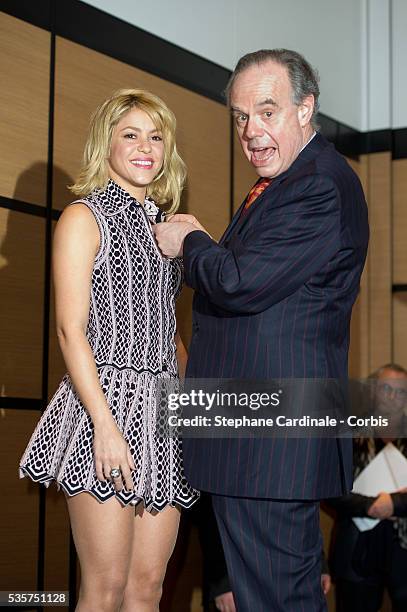 Shakira and French Culture Minister, Frederic Mitterrand during the Decoration Ceremony, at Hotel Majestic in Cannes.