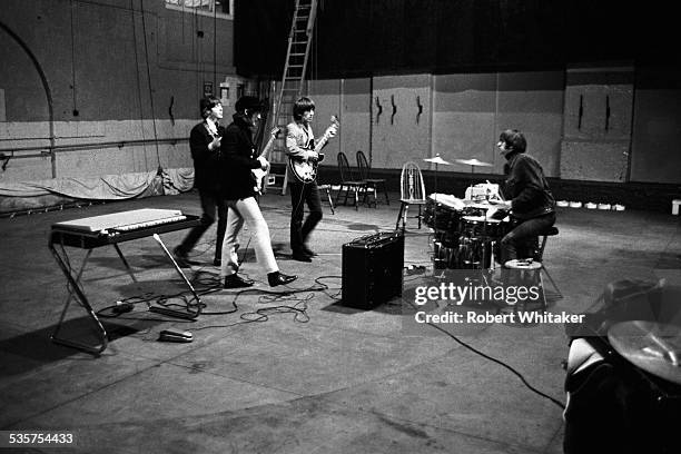 English pop group The Beatles Rehearsing at the Donmar Warehouse theatre, London, 1964. Left to right: Paul McCartney, John Lennon , George Harrison...
