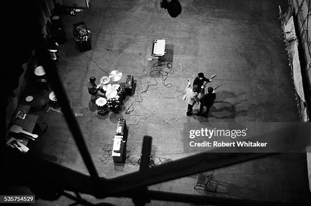English pop group The Beatles Rehearsing at the Donmar Warehouse theatre, London, 1964. Left to right: Ringo Starr, George Harrison , John Lennon and...