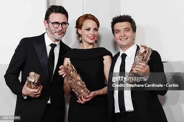 Director Michel Hazanavicius, actress Berenice Bejo and producer Thomas Langmann pose in the Awards Room during the 37th Cesar Film Awards at Theatre...