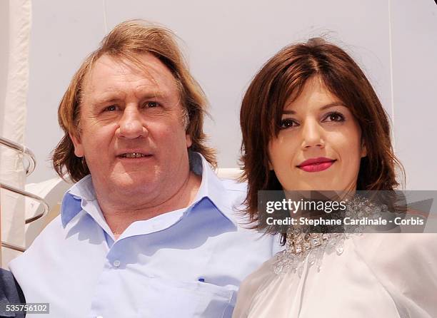 Gerard Depardieu and his girlfriend Clementine Igou promote the actor's Brut Princess Depardieu wine during the 62nd Cannes Film Festival.