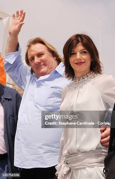 Gerard Depardieu and his girlfriend Clementine Igou promote the actor's Brut Princess Depardieu wine during the 62nd Cannes Film Festival.