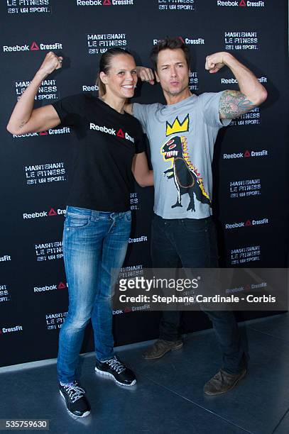 French swimmer Laure Manaudou and Stephane Rousseau help to launch Reebok's The Sport of Fitness campaign at the Georges Pompidou Centre, in Paris