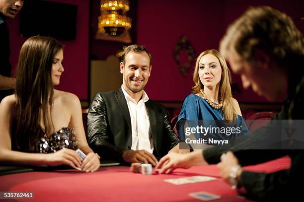 casino card dealer - poker dealer stock pictures, royalty-free photos & images