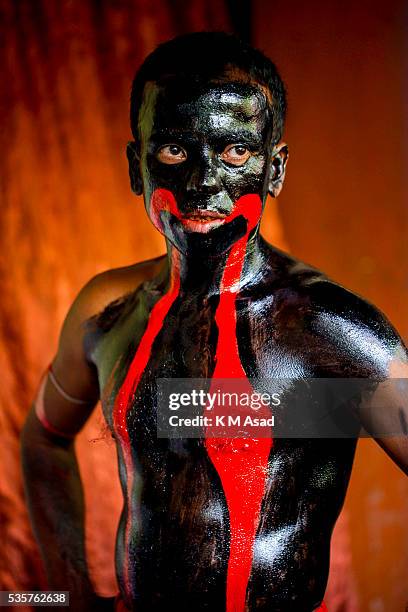 Hindu community devotees make preparations and paint their bodies with colors, ready to perform and celebrate the rituals of Charak Puja also known...