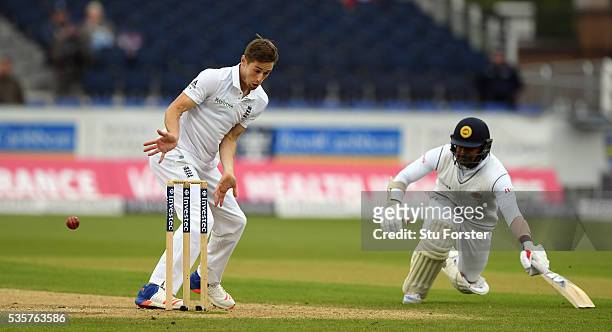 Sri Lanka batsman Rangana Herath makes his ground as England bowler Chris Woakes reacts during day four of the 2nd Investec Test match between...