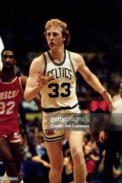 Larry Bird of the Boston Celtics runs a play against the Houston Rockets during an NBA game circa 1980 at the Boston Garden in Boston,...