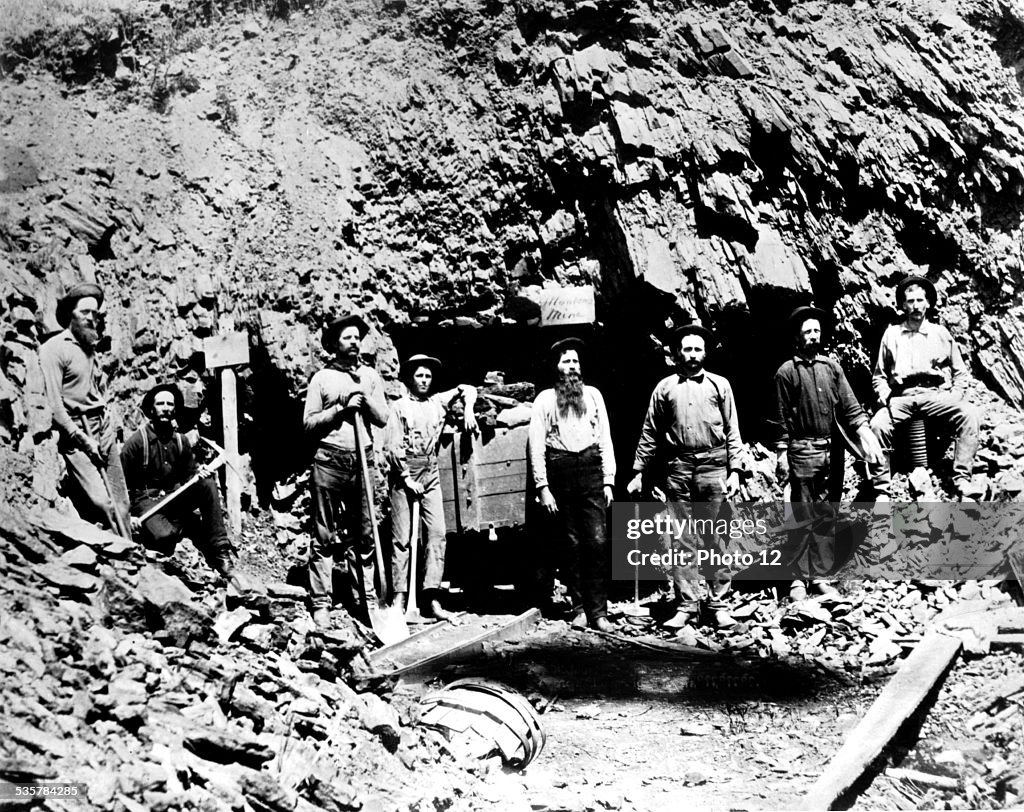 Miners before the entry of a mine in the Montana