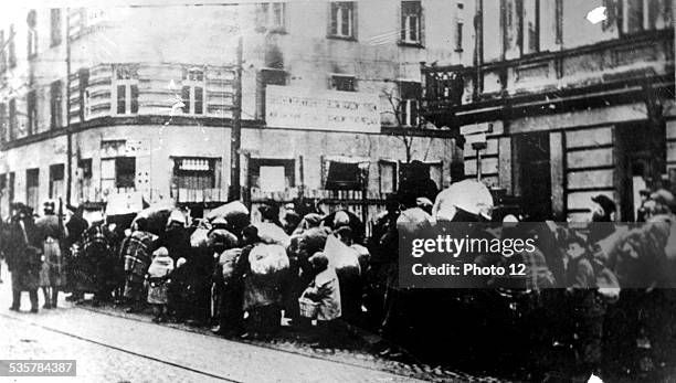 Warsaw Ghetto. A convoy at the ghetto's entrance, 20th, Poland - World War II, Jewish Documentation Center, .