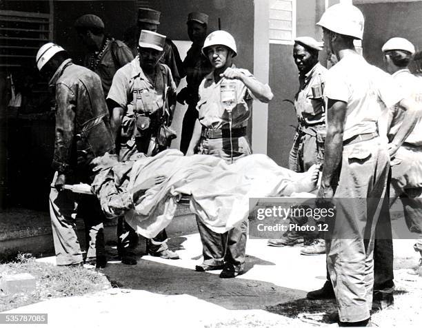 Landig at the Bay of Pigs. Members of the Cuban Red Cross going to a wounded mercenary's assistance Cuba.