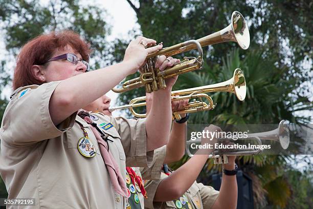 Trumpets play Taps at 2014 Memorial Day Event, Los Angeles National Cemetery, California.