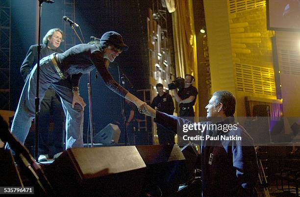 Singer Carly Simon shakes the hand of Brian Wilson at the Tribute to Brian Wilson, New York, New York, March 8, 2001.