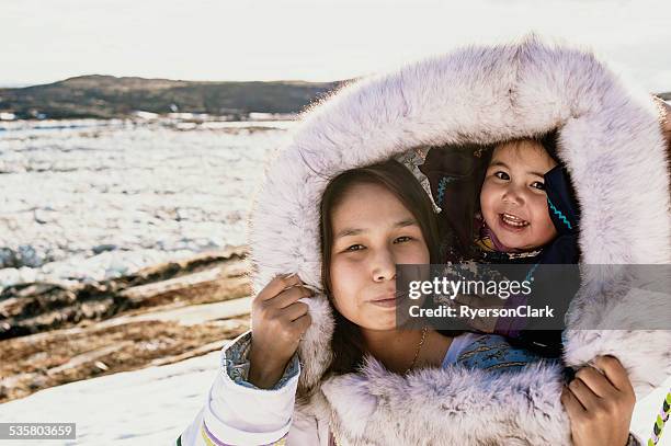 inuit mother and daughter on baffin island, nunavut, canada. - eskimo stock pictures, royalty-free photos & images