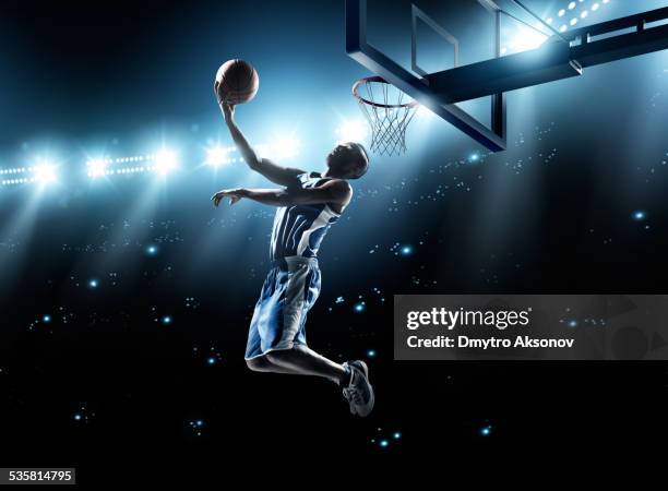 basketball player in jump shot - basketbalcompetitie stockfoto's en -beelden