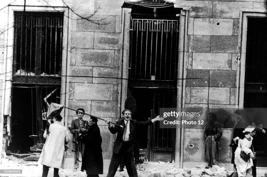 November 1956, Budapest, rebels assault the building behind the tank.