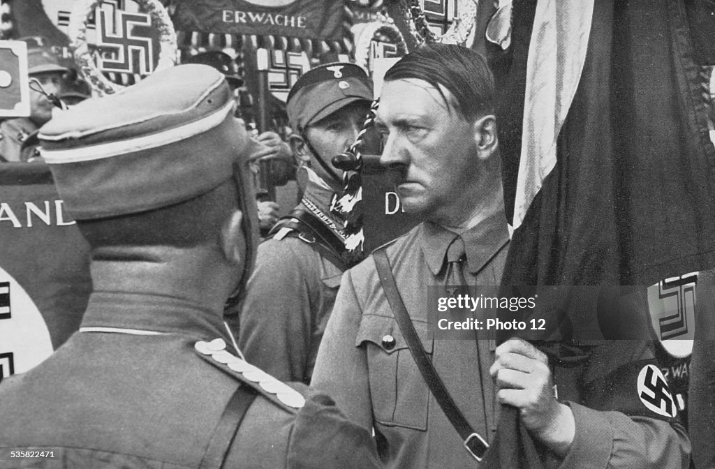Hitler holding a standard during the Party Congress of the NSDAP (1935)