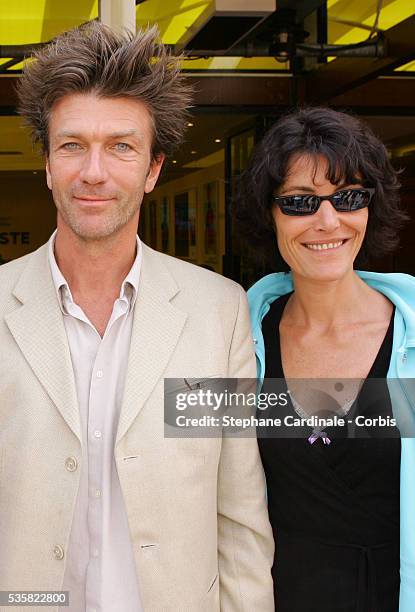 Actors Philippe Caroit and Caroline Tresca attend the Lacoste Lunch at Roland Garros village during the 2004 French Open Tennis tournament.