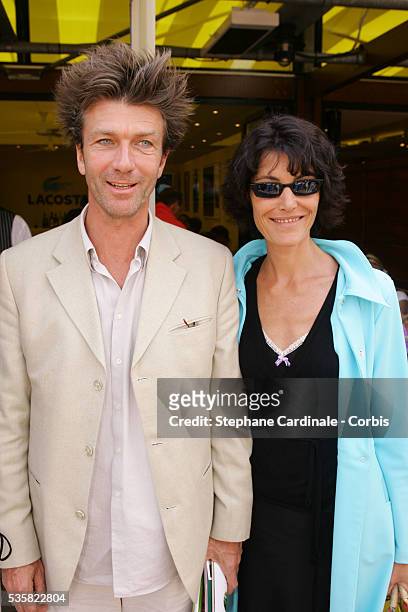 Actors Philippe Caroit and Caroline Tresca attend the Lacoste Lunch at Roland Garros village during the 2004 French Open Tennis tournament.