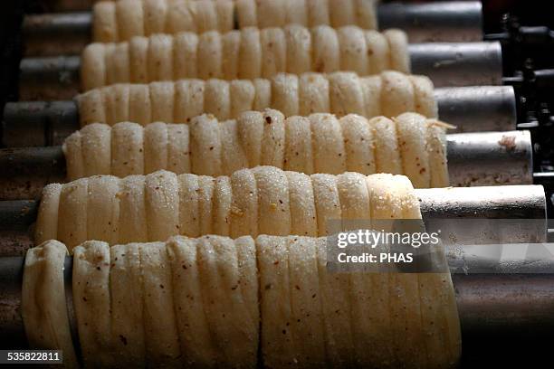 Trdelnik. Traditional cake and sweet pastry. It is made from rolled dough, wrapped around a cylinder, then grilled and topped with sugar and...