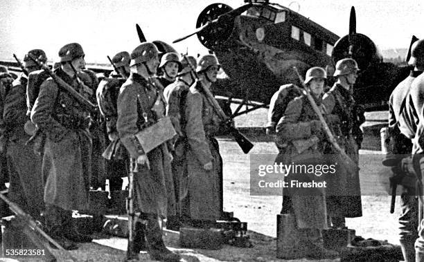 Germany at war, Signal magazine, 1940. Battle of Noway, German infantry ready to enmabrk on Junkers 52 airplanes, May 15 1940.