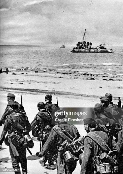 Germany at war, Signal magazine, 1940. Battle of France. German infantry marching on the sand at Duquerque or Dunkirk. The Battle of Dunkirk was an...