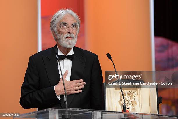 Director Michael Haneke receives the Palme D'Or for Amour onstage at the Closing Ceremony during the 65th Annual Cannes Film Festival.