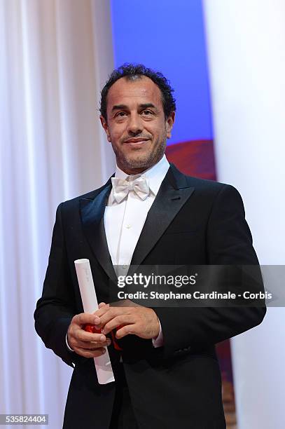 Grand Prix du Jury winner for 'Reality' Matteo Garrone poses during the 65th Annual Cannes Film Festival.