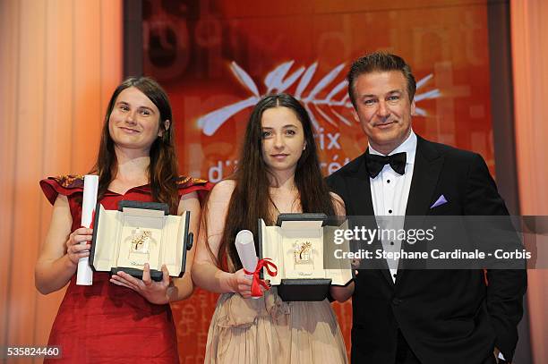 Best Actresses Cosmina Stratan and Cristina Flutur of 'Beyond The Hills' by Cristian Mungiu pose with actor Alec Baldwin onstage at the Closing...