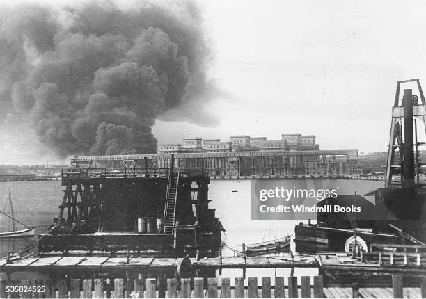 Petrol tanks burning in the Harbour of Constanza, evacuated by the Romanians, 22nd October 1916.
