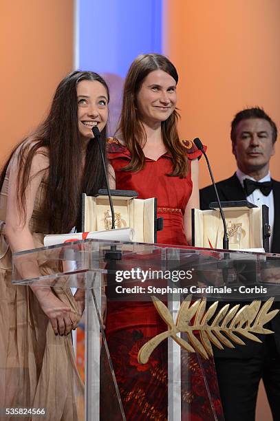 Best Actresses Cosmina Stratan and Cristina Flutur of 'Beyond The Hills' by Cristian Mungiu pose with actor Alec Baldwin onstage at the Closing...