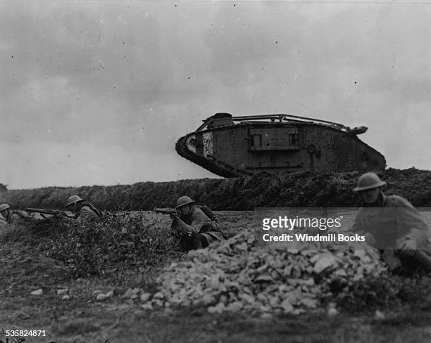 107th Infantry Regiment, 27th Division train with tanks near Beauquesnes, France, 13 September, 1918. The tanks would charge an imaginary enemy...