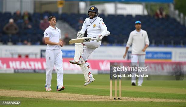 Sri Lanka batsman Dinesh Chandimal celebrates his century during day four of the 2nd Investec Test match between England and Sri Lanka at Emirates...