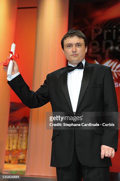 Winner Scenario for 'Beyond the Hills' Christian Mungiu onstage at the Closing Ceremony during the 65th Annual Cannes Film Festival.