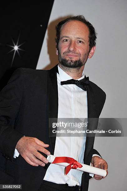 Carlos Reygadas, winner of the award for Best Director for Post Tenebras Lux poses at the Winners Photocall during the 65th Cannes International Film...