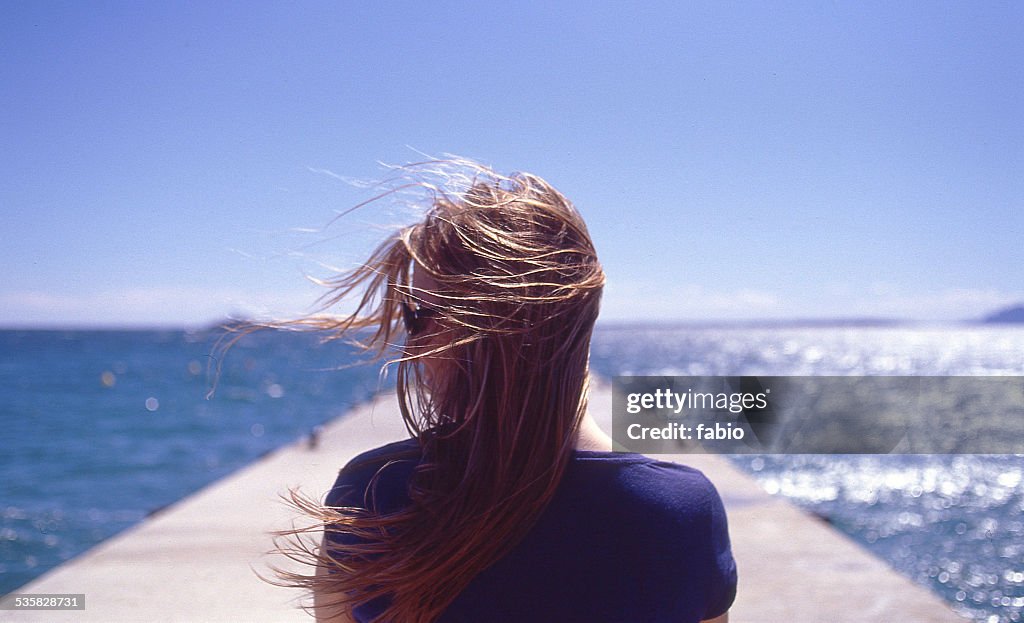 France, Juan les Pins, Rear view of woman with wind blowing