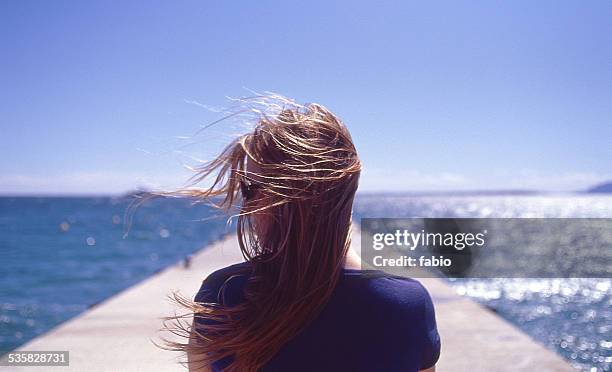 france, juan les pins, rear view of woman with wind blowing - juan les pins bildbanksfoton och bilder