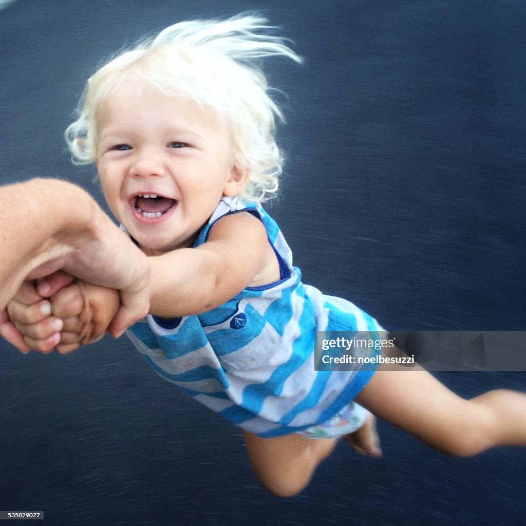 Toddler being spun around