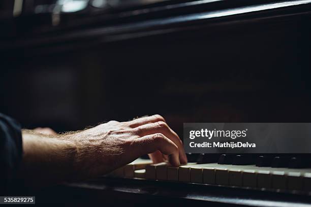 belgium, flanders, west flanders, brugge, close-up of pianist's hand on piano keyboard - pianist foto e immagini stock