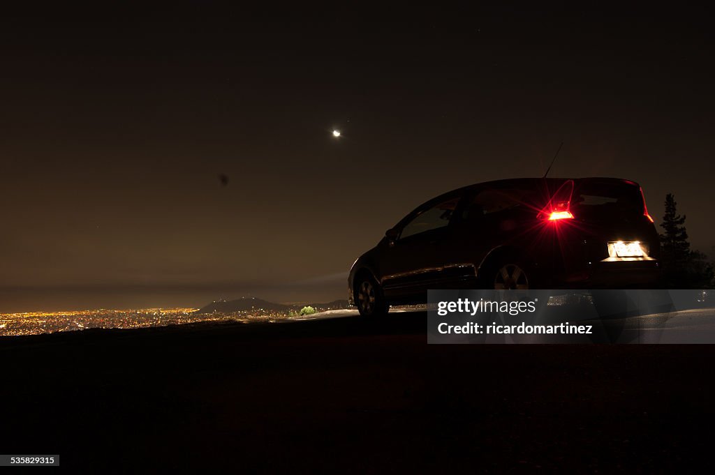 Chile, Santiago, Car on hill above city