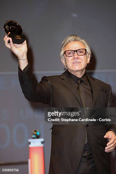 Actor Harvey Keitel receives an award for his career during the opening ceremony of the 38th Deauville American Film Festival, in Deauville.