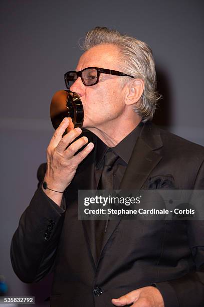 Actor Harvey Keitel receives an award for his career during the opening ceremony of the 38th Deauville American Film Festival, in Deauville.