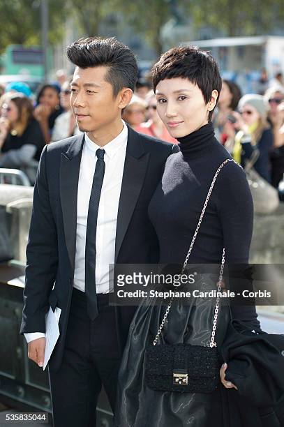 Xia Yu and Yuan Quan attend the Christian Dior Spring/Summer 2013 show as part of Paris Fashion Week at Hotel National des Invalides, in Paris.
