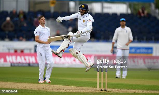 Sri Lanka batsman Dinesh Chandimal celebrates his century during day four of the 2nd Investec Test match between England and Sri Lanka at Emirates...