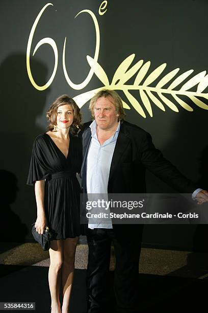 Gerad Depardieu and Clementine Igou arrive at the anniversary dinner for the 60th Cannes Film Festival.