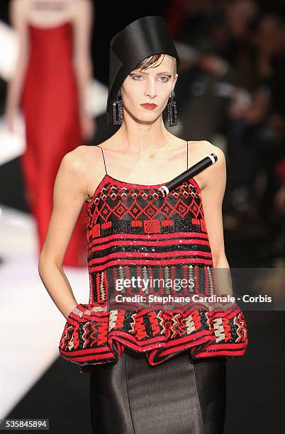 Model walks the runway during the Giorgio Armani Prive Spring/Summer 2013 Haute-Couture show, in Paris.