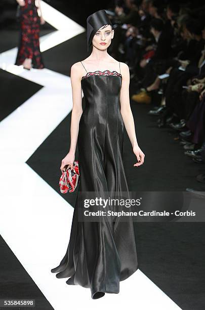 Model walks the runway during the Giorgio Armani Prive Spring/Summer 2013 Haute-Couture show, in Paris.